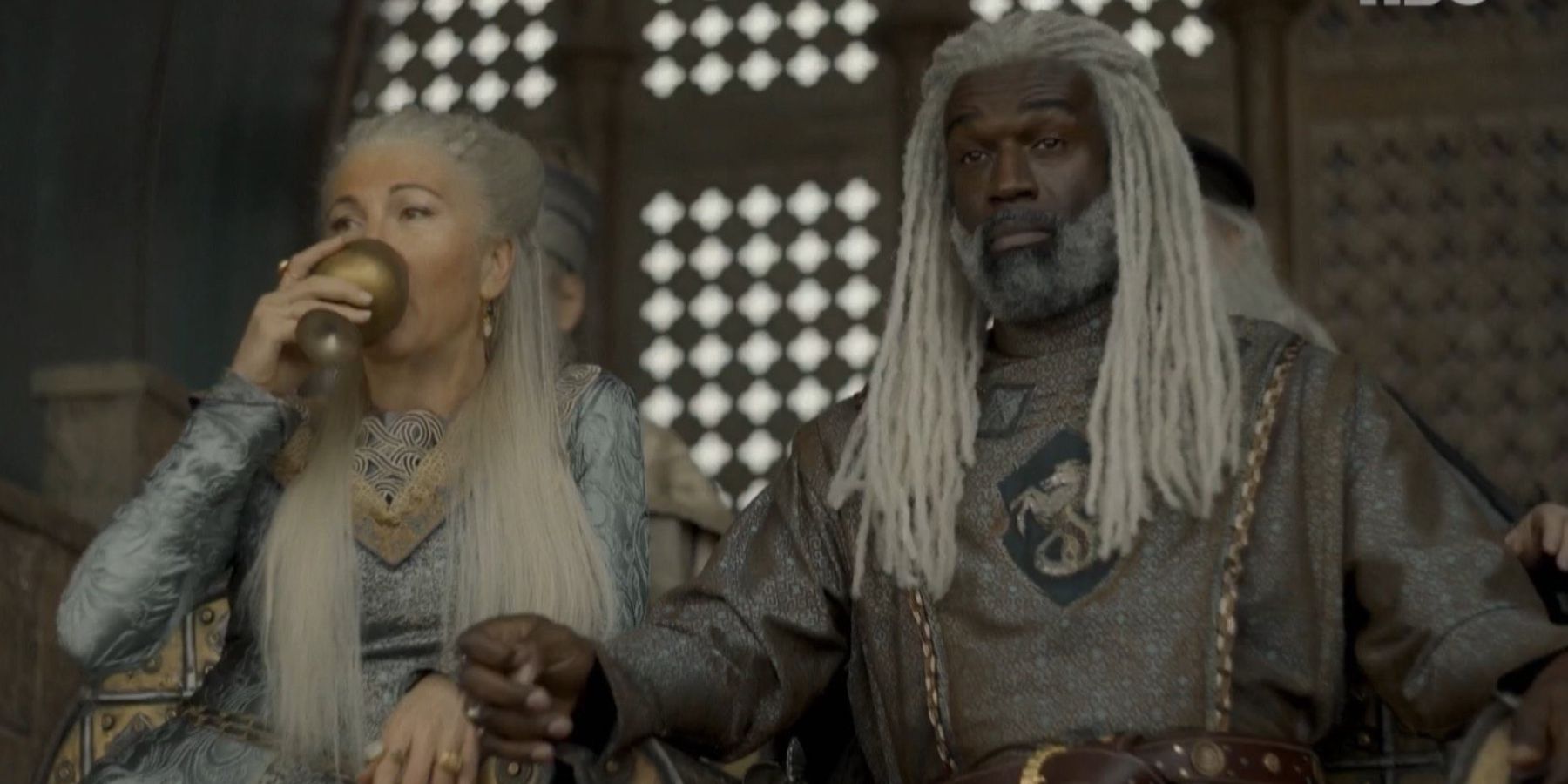 Rhaenys Targaryen and Corlys Velaryon watch tournament in House of the Dragon.