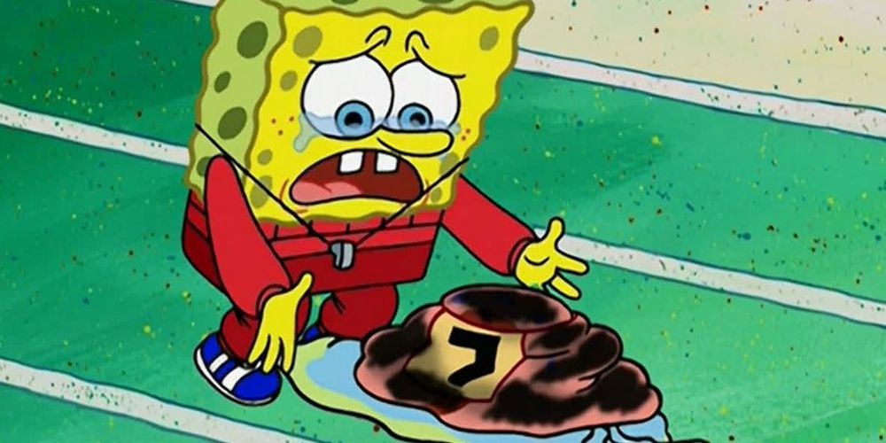 SpongeBob in a red jumpsuit crying over his pet snail, Gary, who is injured, on race track. Image source: twitter.com