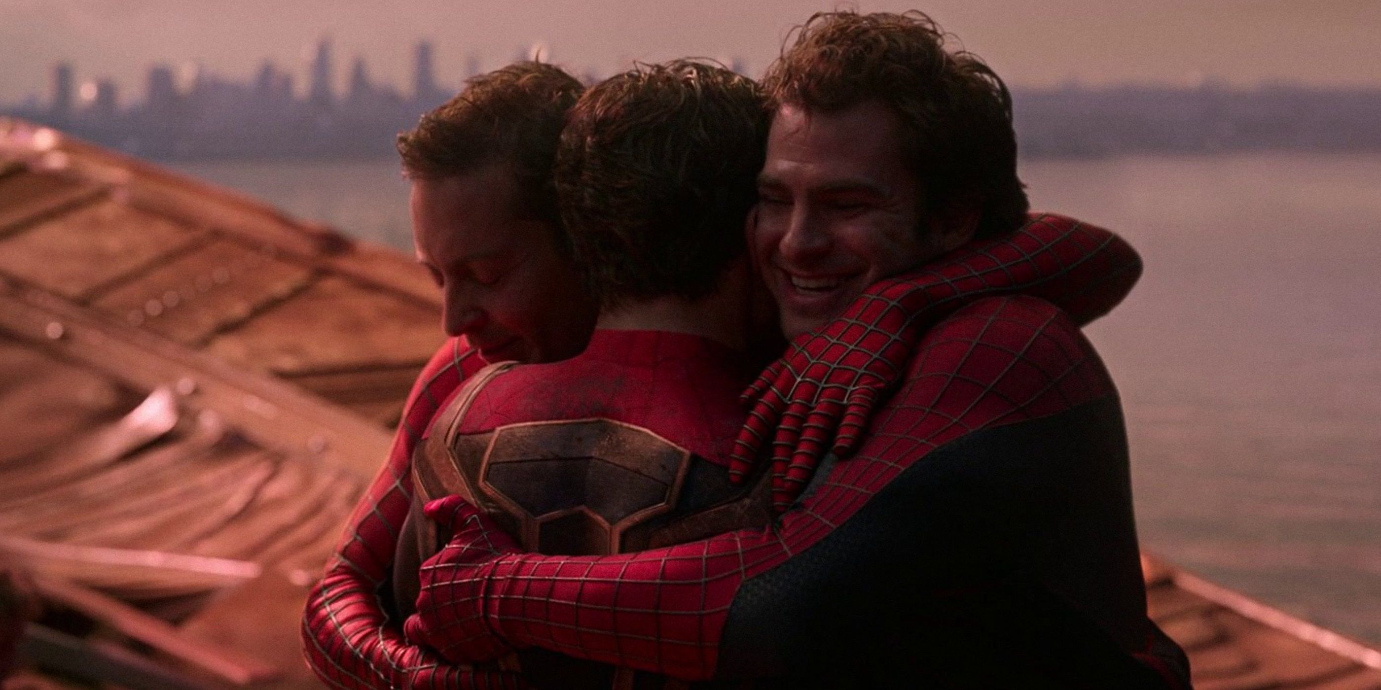 The three Spider-Men embrace at the end of No Way Home