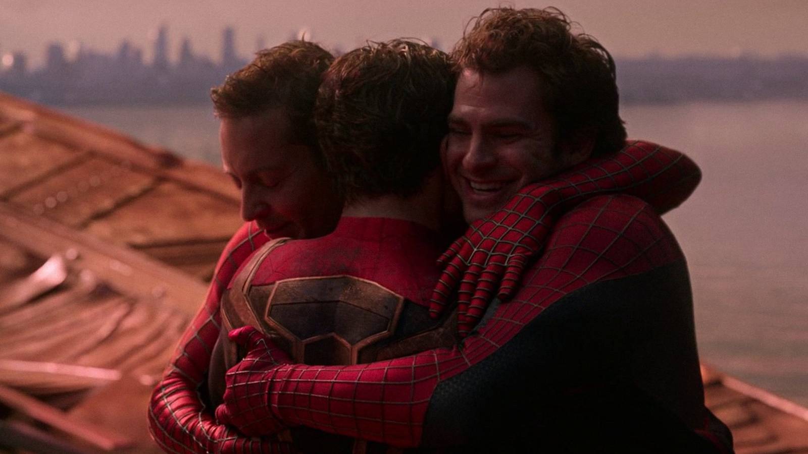 The three Spider-Men embrace at the end of No Way Home