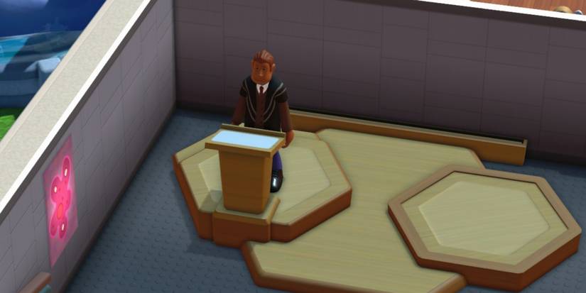 Two Point Campus Teacher At The Lectern In The Lecture Hall