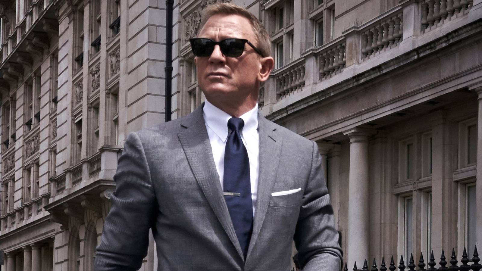 James Bond (Daniel Craig) wearing a suit and sunglasses