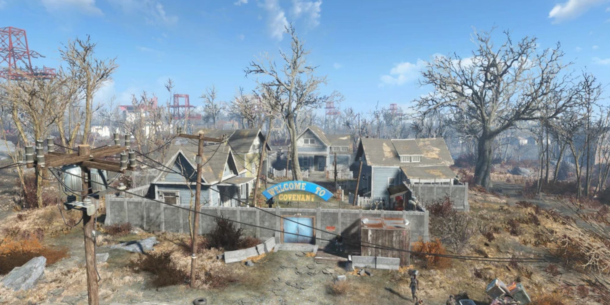 A small, walled settlement sits in the wasteland