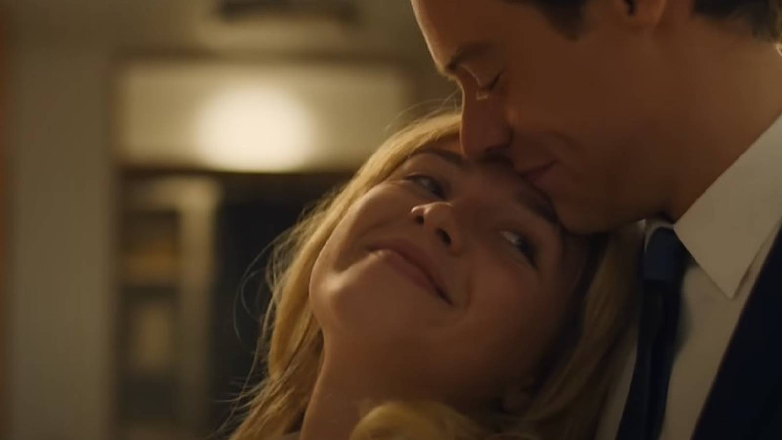 Florence Pugh and Harry Styles smiling at each other in Don't Worry Darling