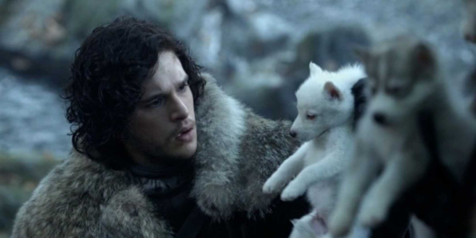 Jon Snow looks at Ghost the Direwolf in Game of Thrones.