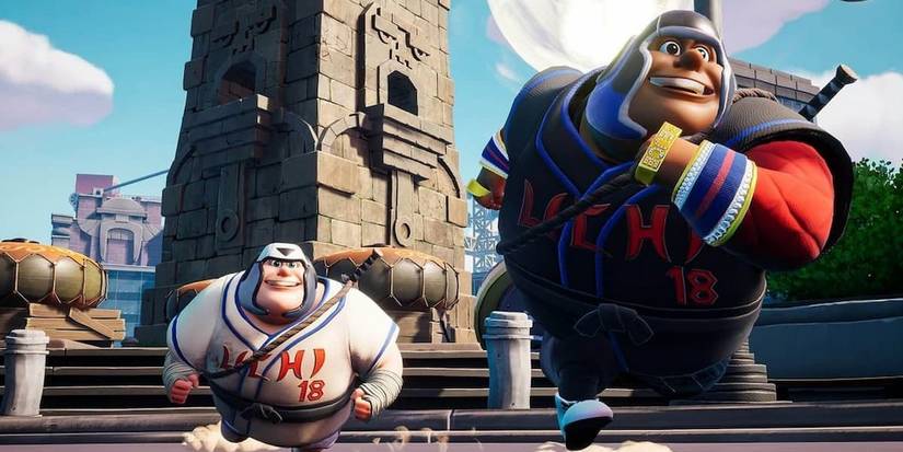 rumbleverse a player and teamrate running away from a building 