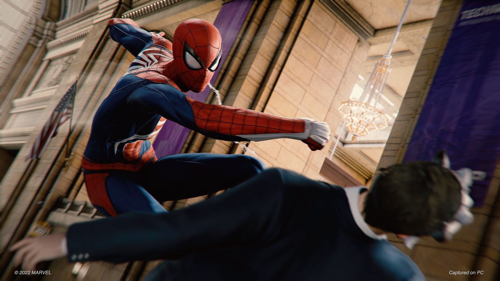 spiderman punching bad guy