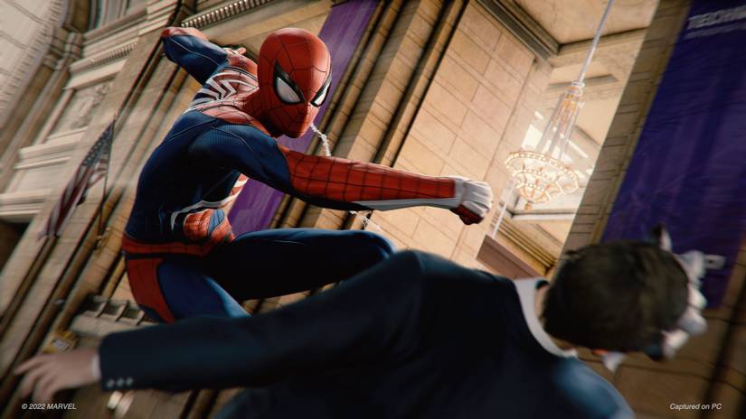 spiderman punching bad guy