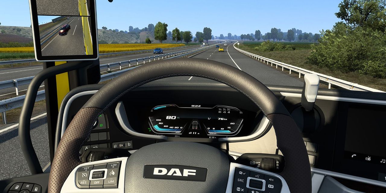 A player driving a truck along the road in Euro Truck Simulator 2