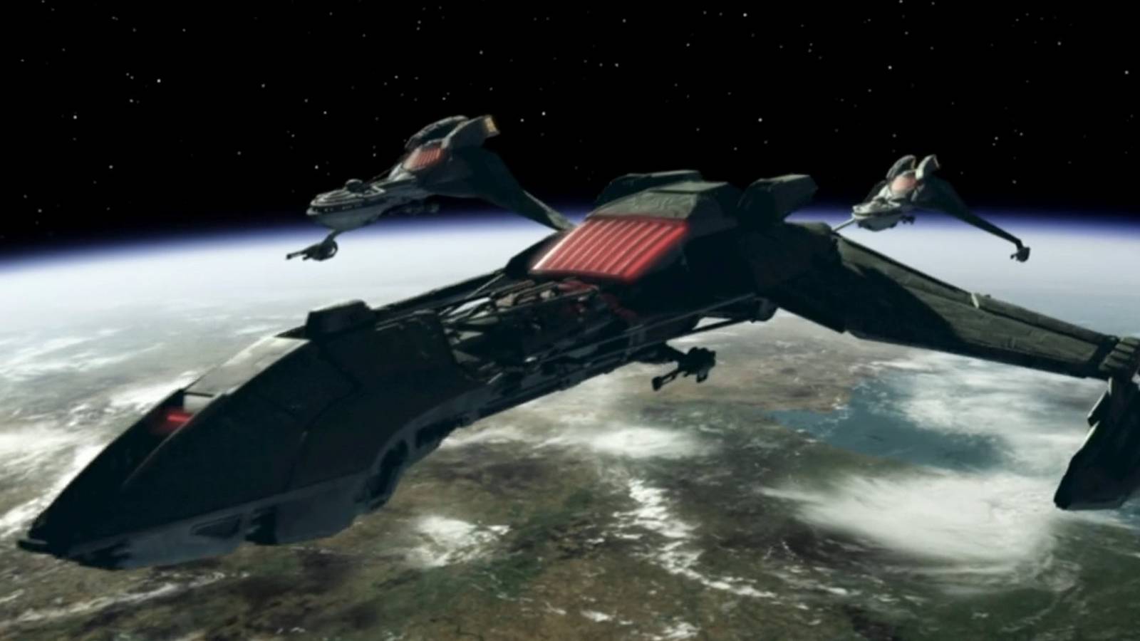 A Klingon ship flies through space in Star Trek