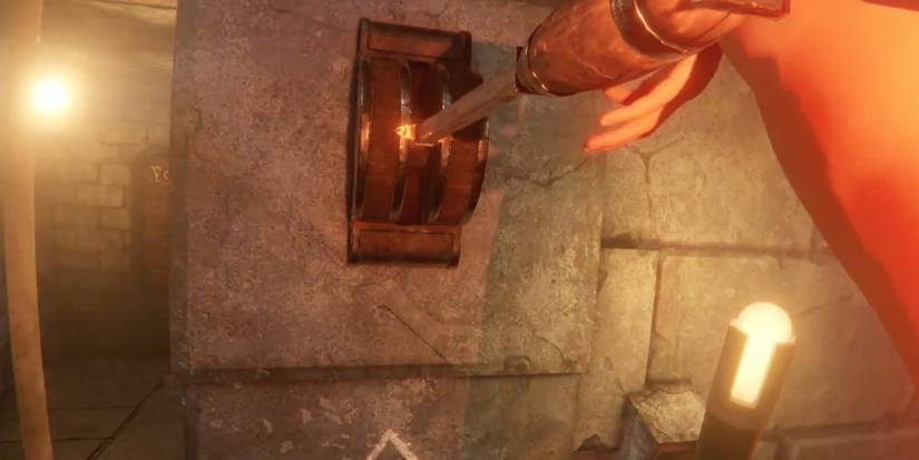 Player pulls down a lever to open the door