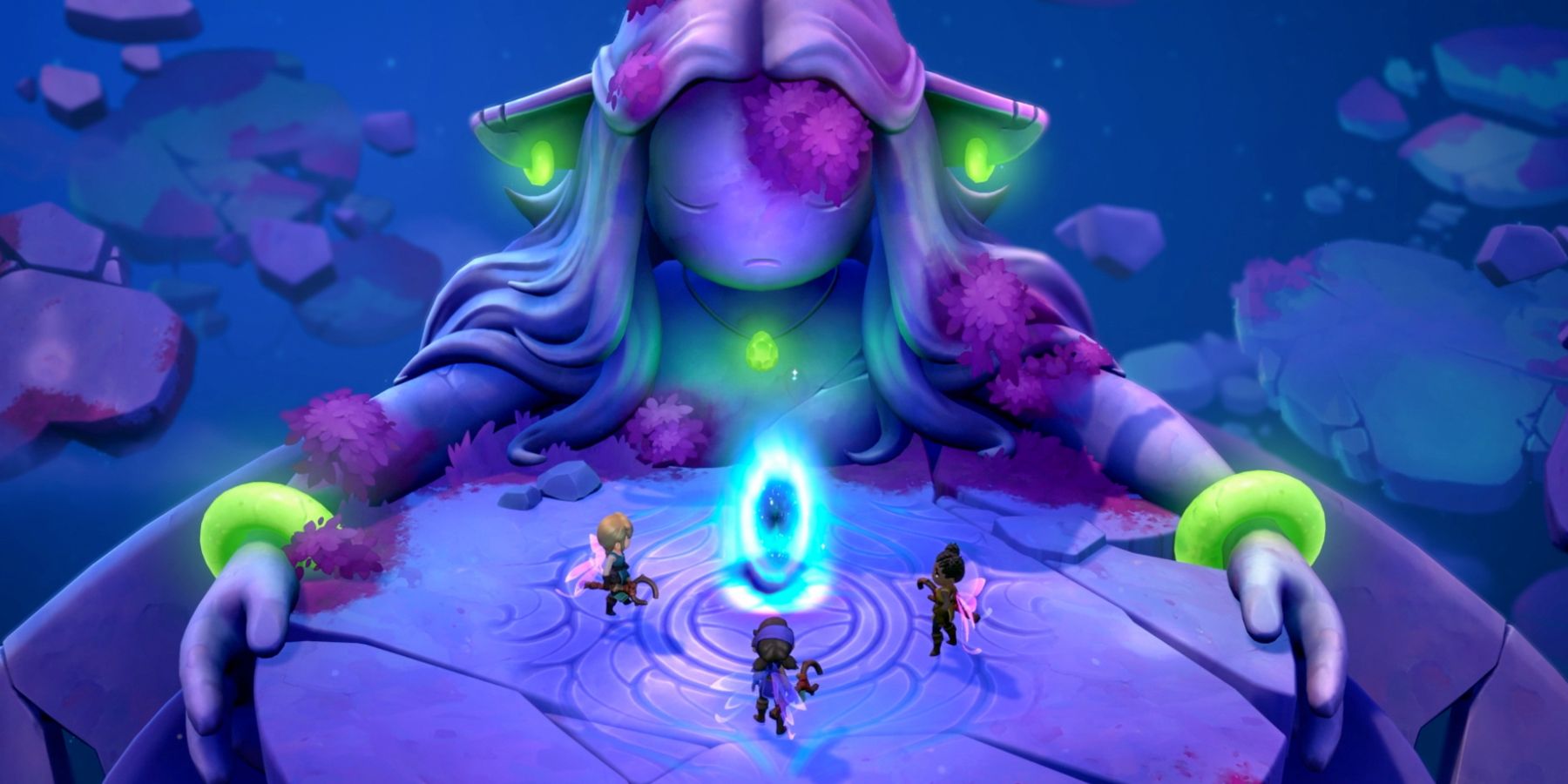 Three players in front of statue with glowing jewelry.