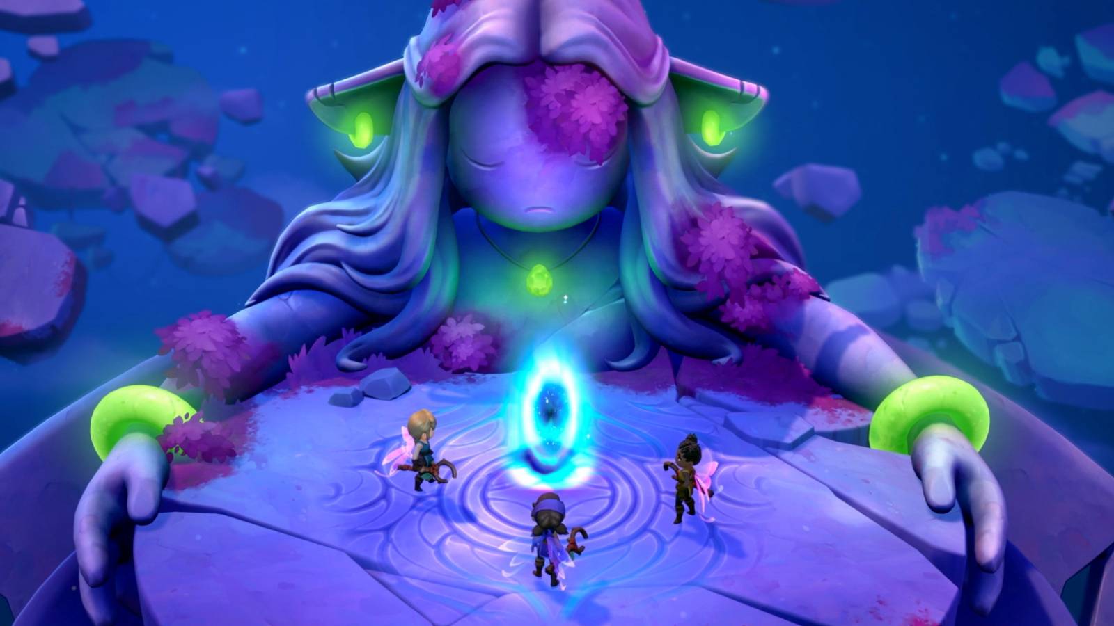 Three players in front of statue with glowing jewelry.