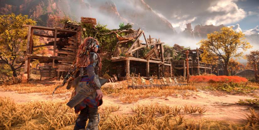 Aloy standing outside of the Horizon Forbidden West Relic Ruin in the Daunt