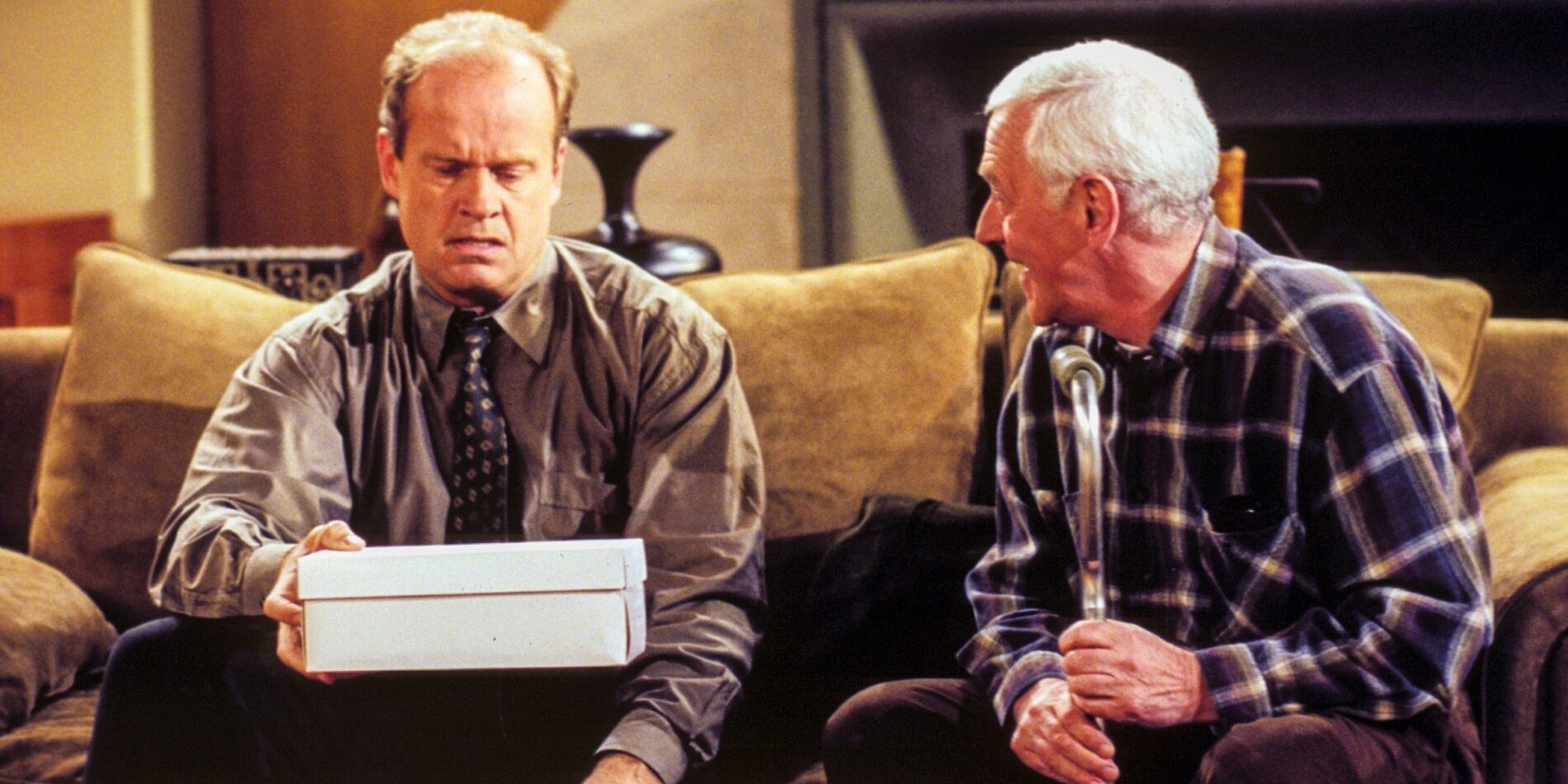 Frasier and Marty sit on the couch in Frasier