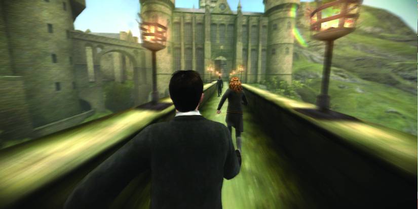 Harry Potter (center) running across a bridge towards part of the castle. Image source: gamesradar.com