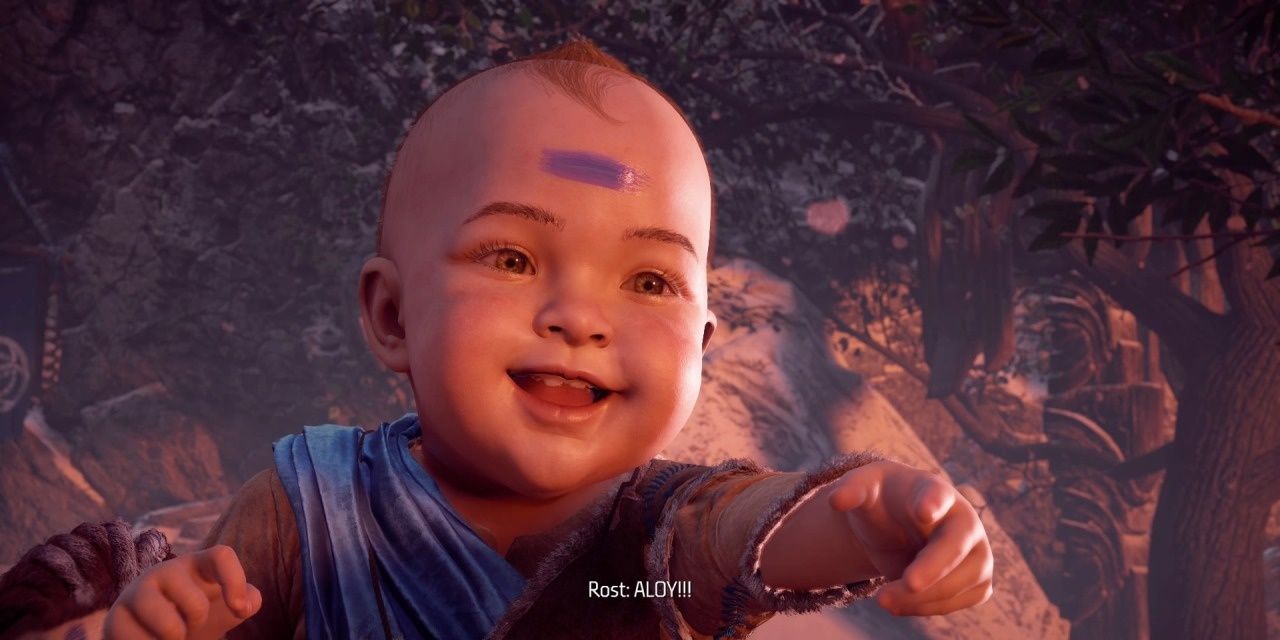Baby Aloy smiling and pointing in Horizon Zero Dawn