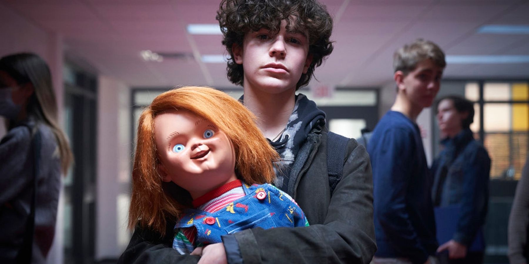 Jake Wheeler holding the doll in Chucky TV Show