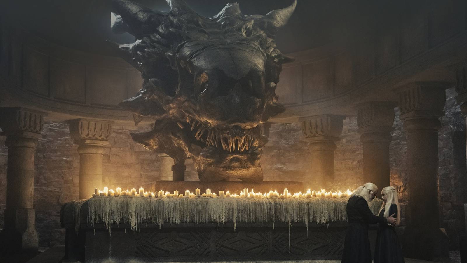 King Viserys and Rhaenyra talk near Balerion's skull in House of the Dragon.