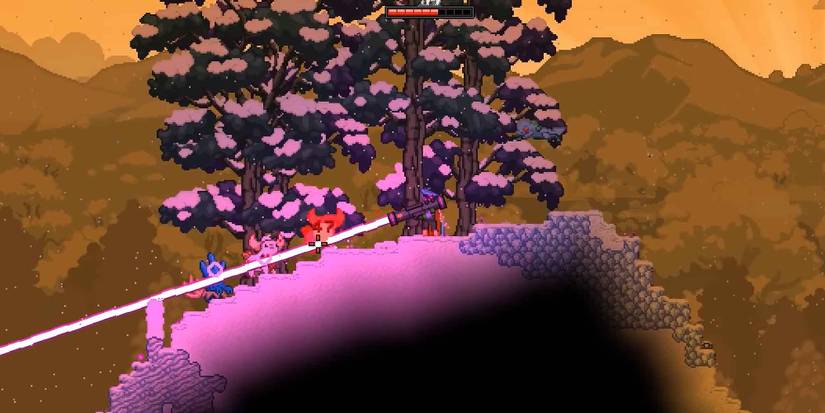 The Lazercaster cutting through multiple enemies in Starbound