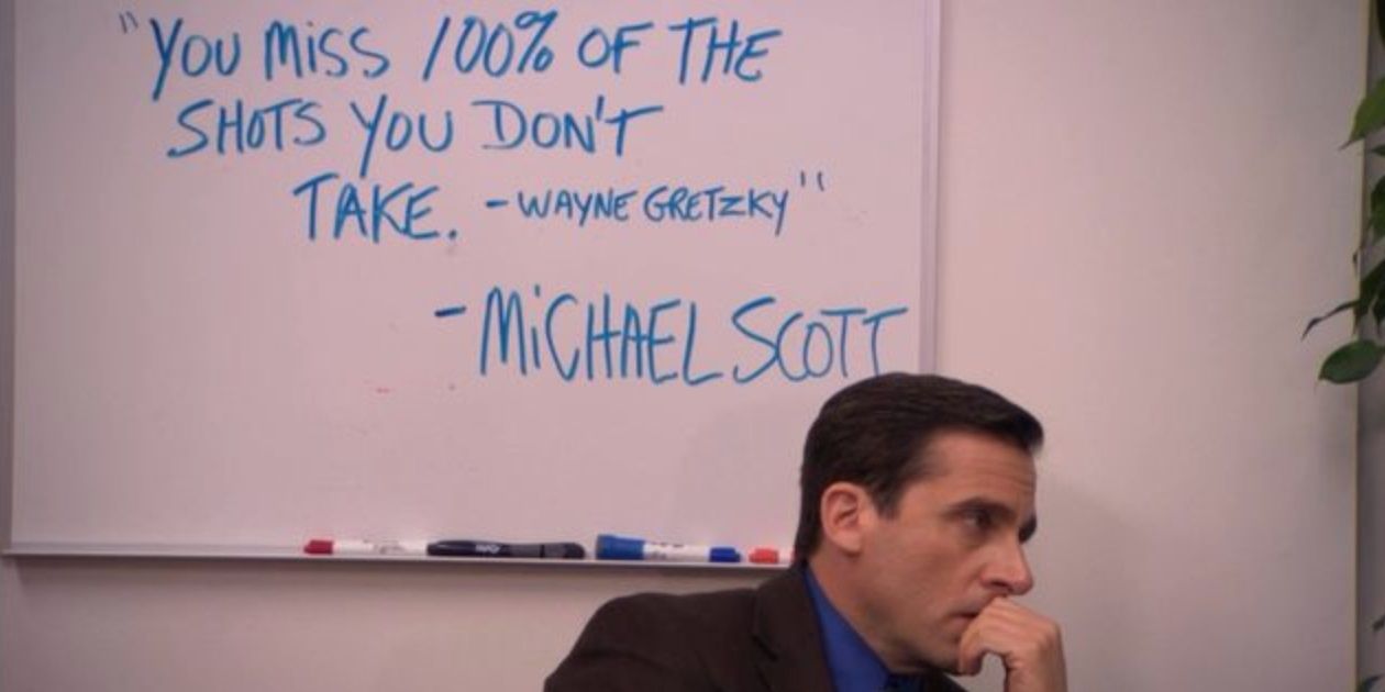 Michael Scott sits next to a quote in The Office