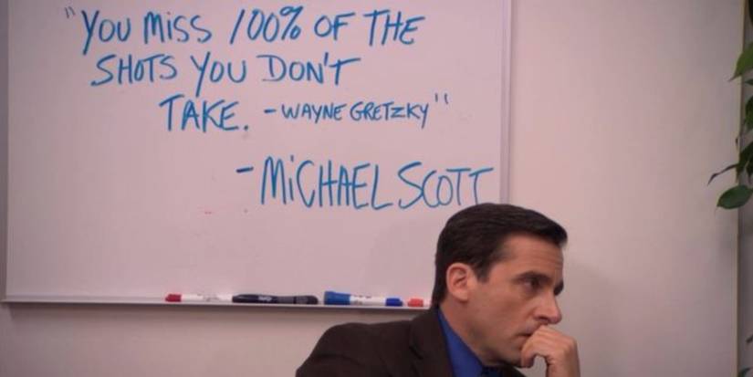 Michael Scott sits next to a quote in The Office