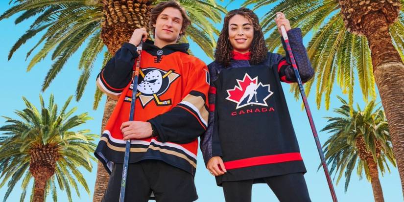Trevor Zegras and Sarah Nurse posing for the NHL 23 cover