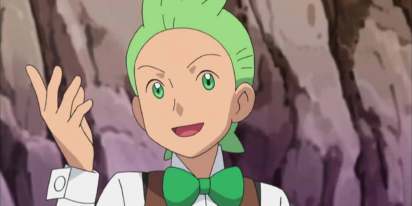 Cilan raising his hand near a mountain in the anime