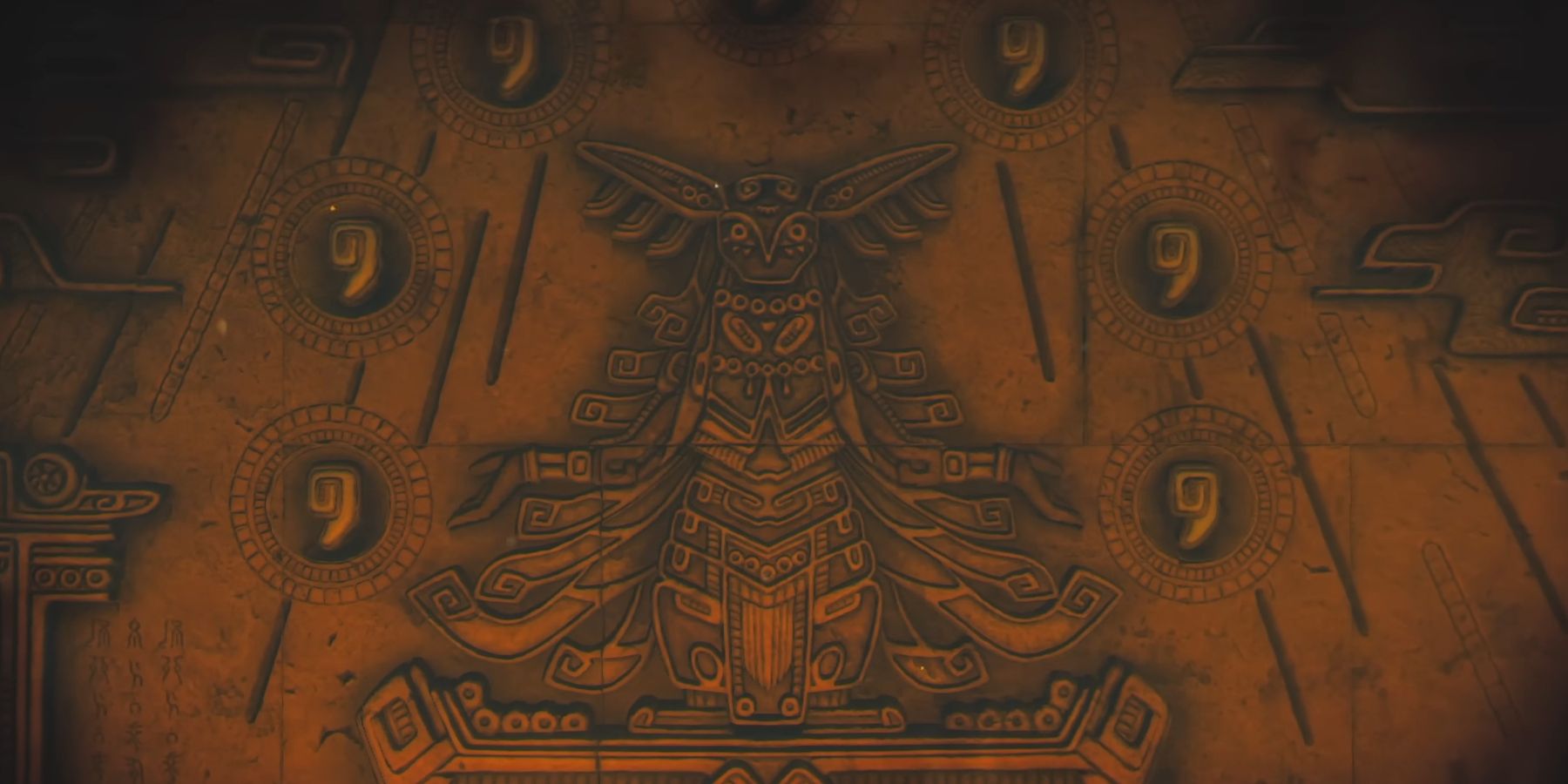 A carving of an ornate deity, encircled by a series of tear-shaped symbols. Image Source: Nintendo