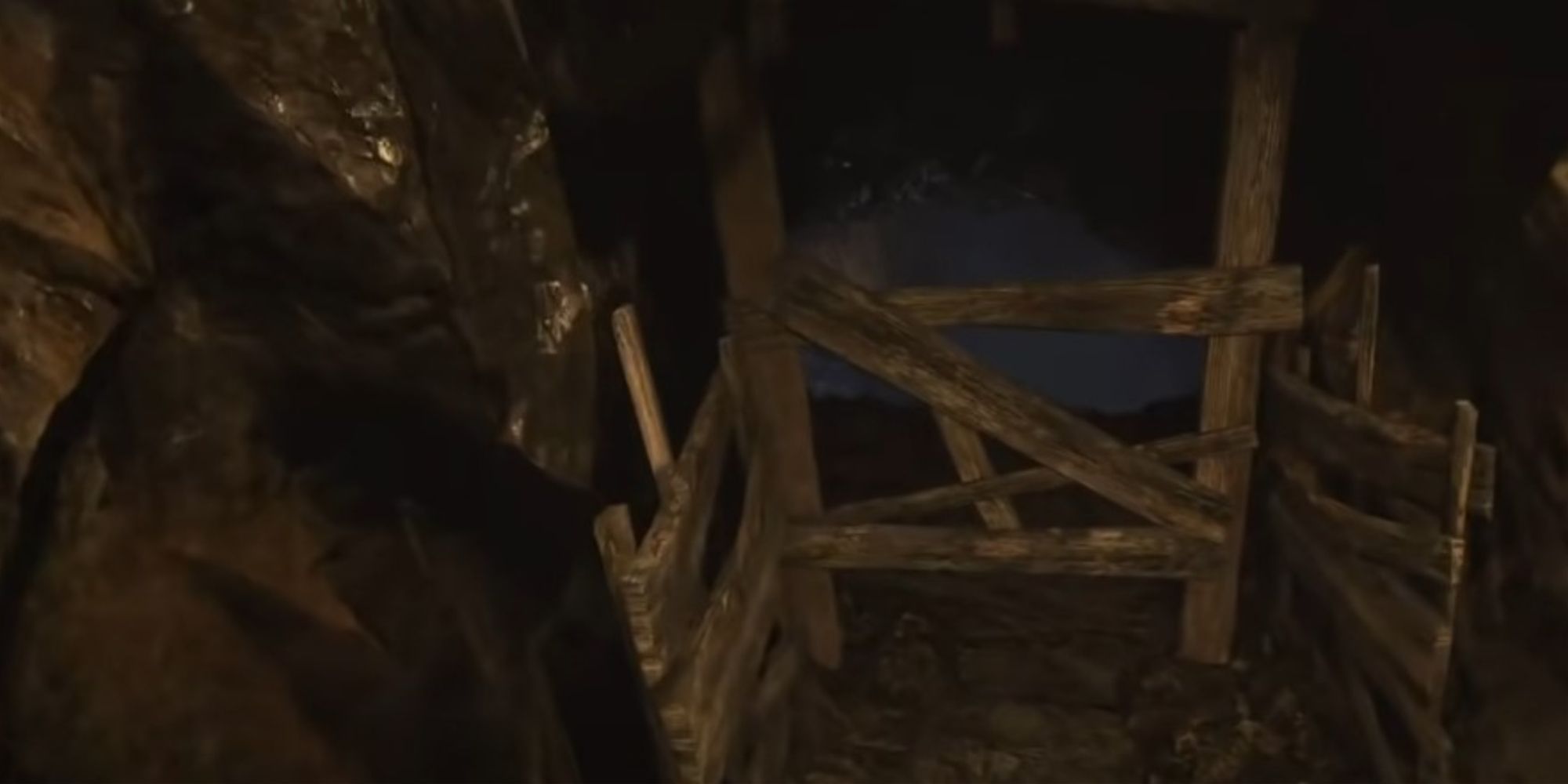 Resident Evil Village Running Through A Wooden Barrier With Hands Tied