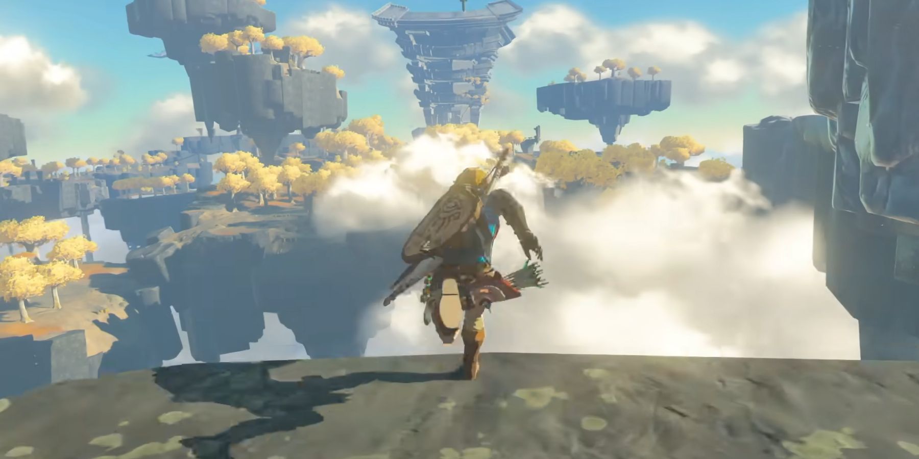 Link (center) running at the edge of a cliff surrounded by islands floating in the sky. Image source: Nintendo