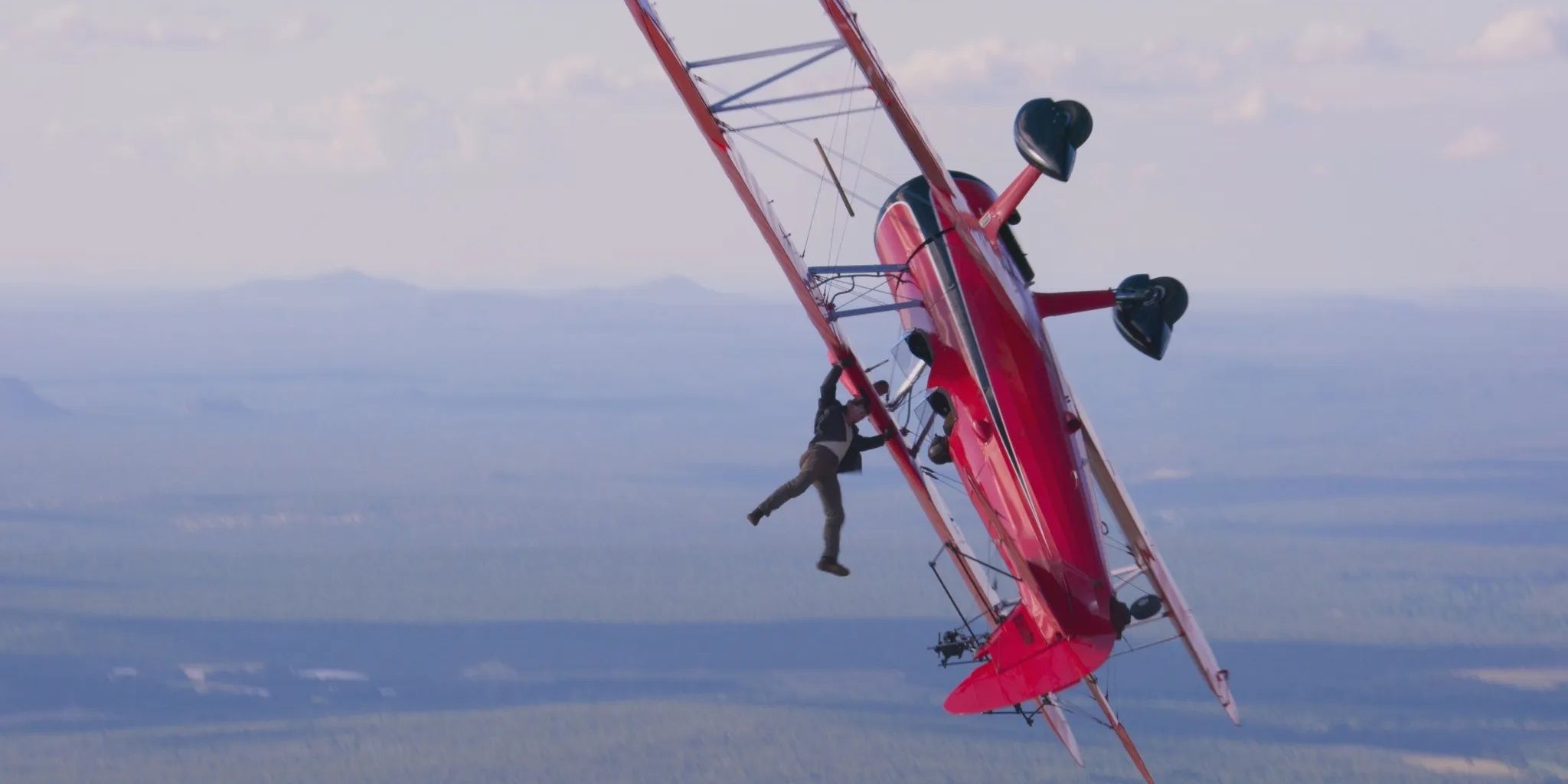 Tom Cruise hangs from a biplane in Mission Impossible Dead Reckoning Part One