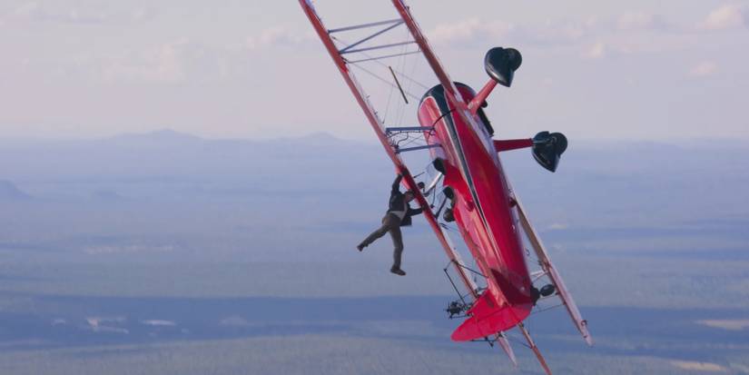 Tom Cruise hangs from a biplane in Mission Impossible Dead Reckoning Part One