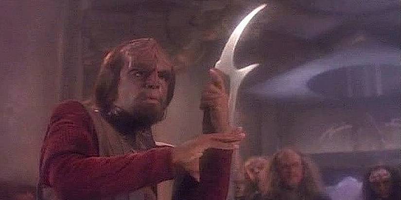 Worf holds bat'leth in Star Trek