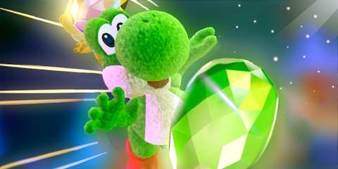 Yoshi posing with a green gem in Yoshi's Crafted World