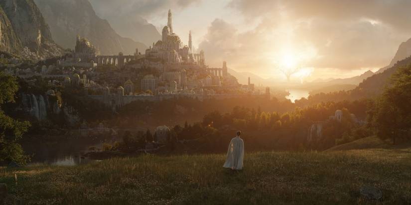 An elf stands in a field overlooking the city of Lindon