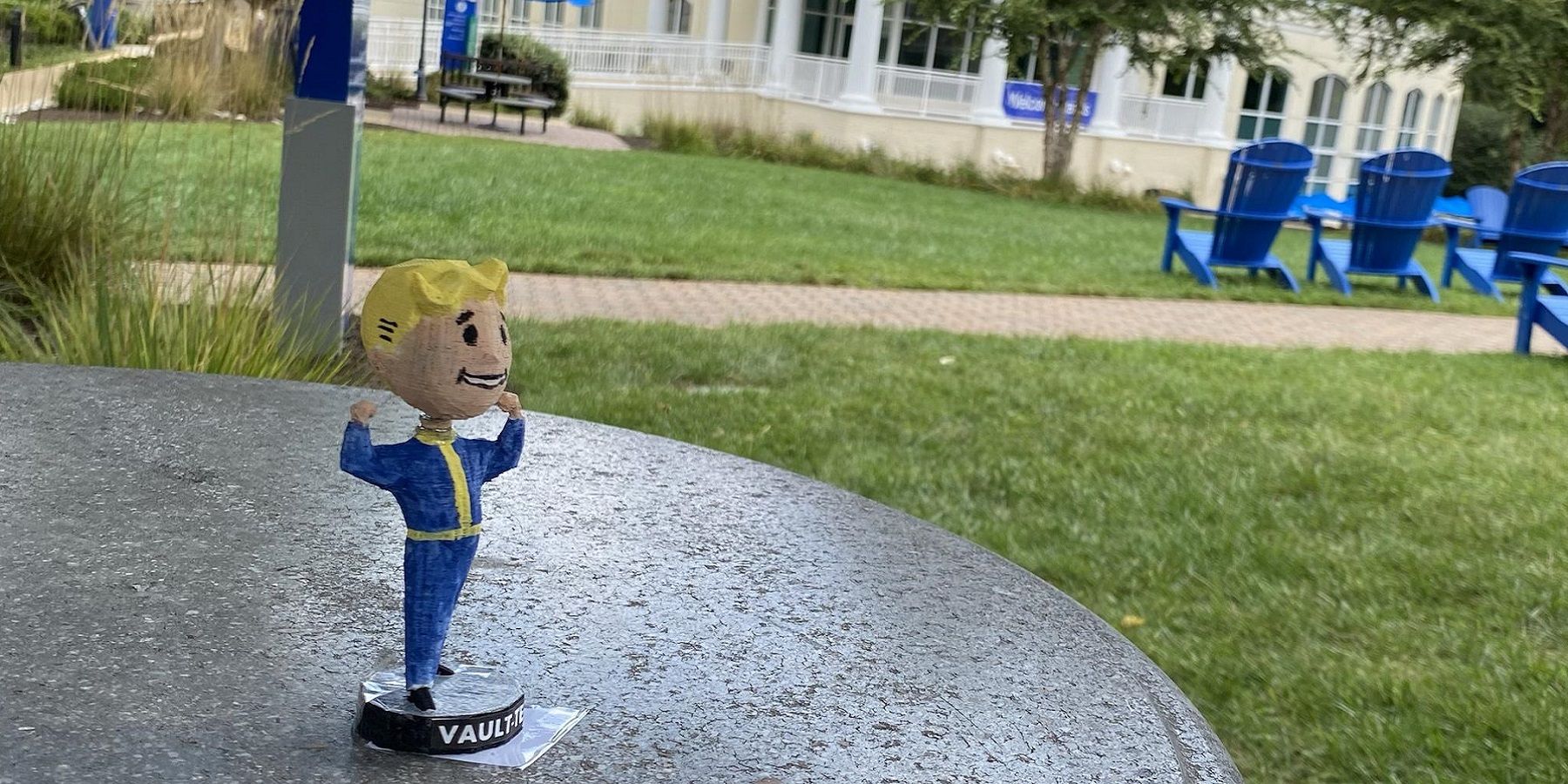 Photo of a Fallout 3 bobblehead figure outside near some grass.
