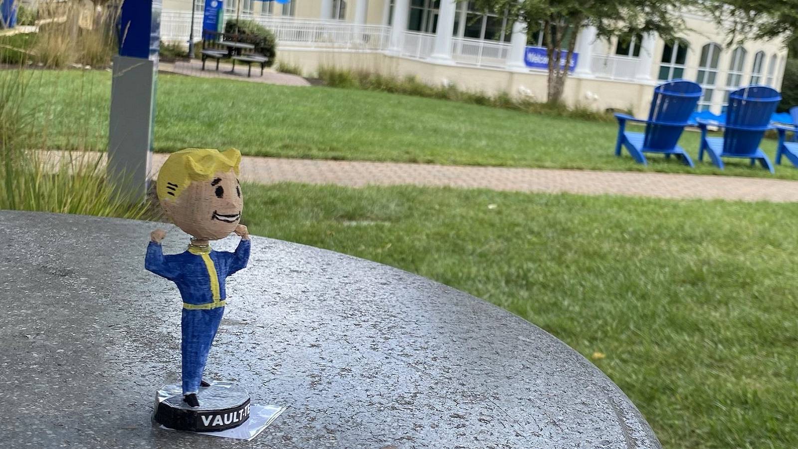 Photo of a Fallout 3 bobblehead figure outside near some grass.