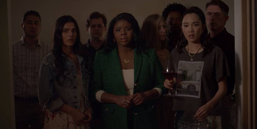 Family and friends watch marriage proposal in American Horror Stories "Necro"