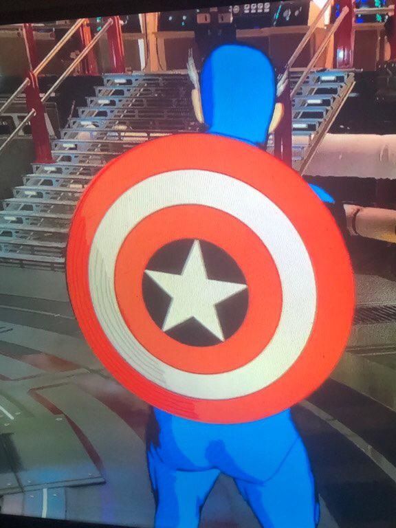 A colorful Captain America can be seen with his shield on his back.