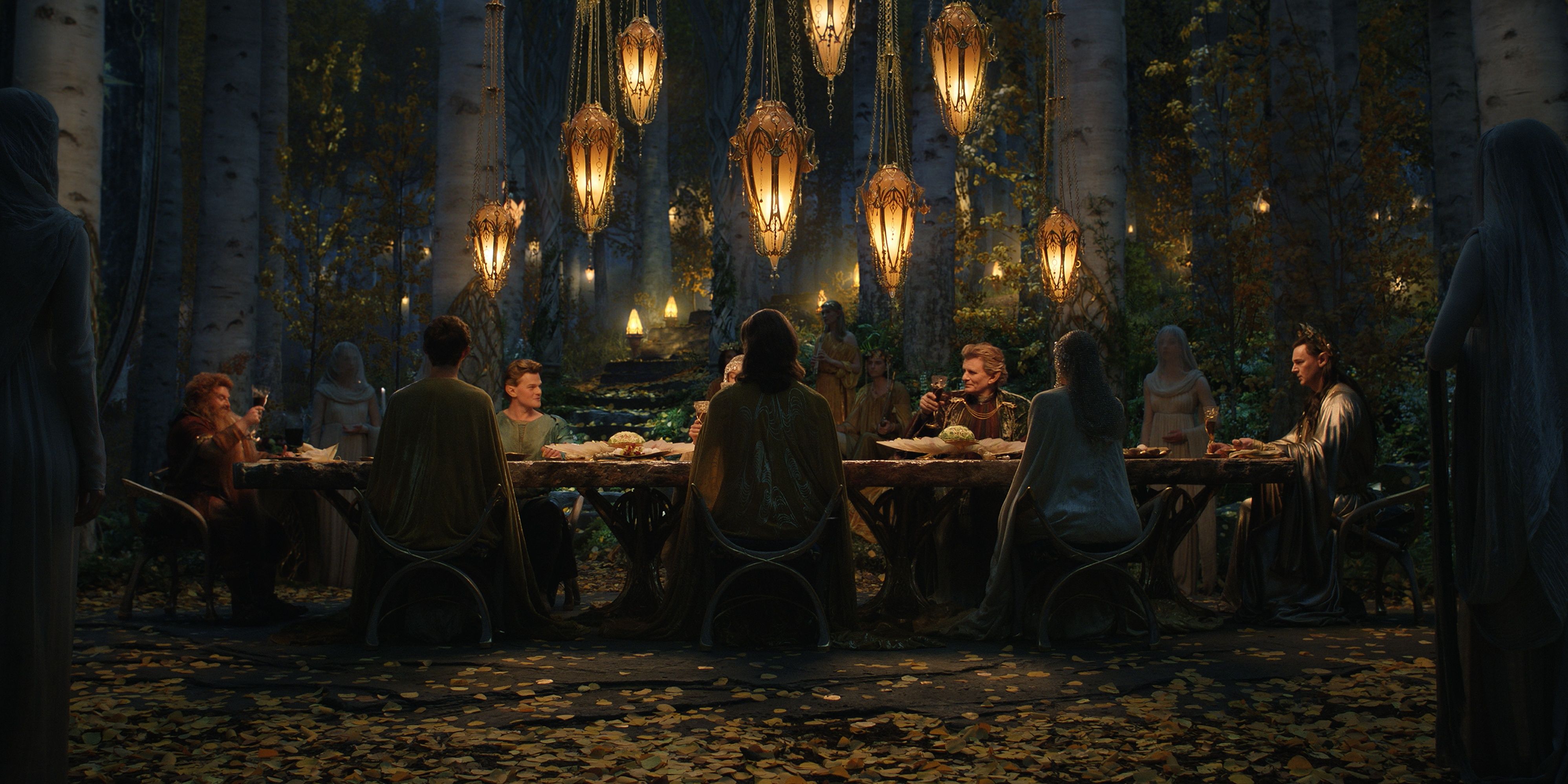 The High Elves eat at the dinner table