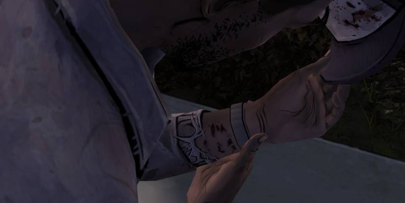 Lee examining his bite mark in The Walking Dead