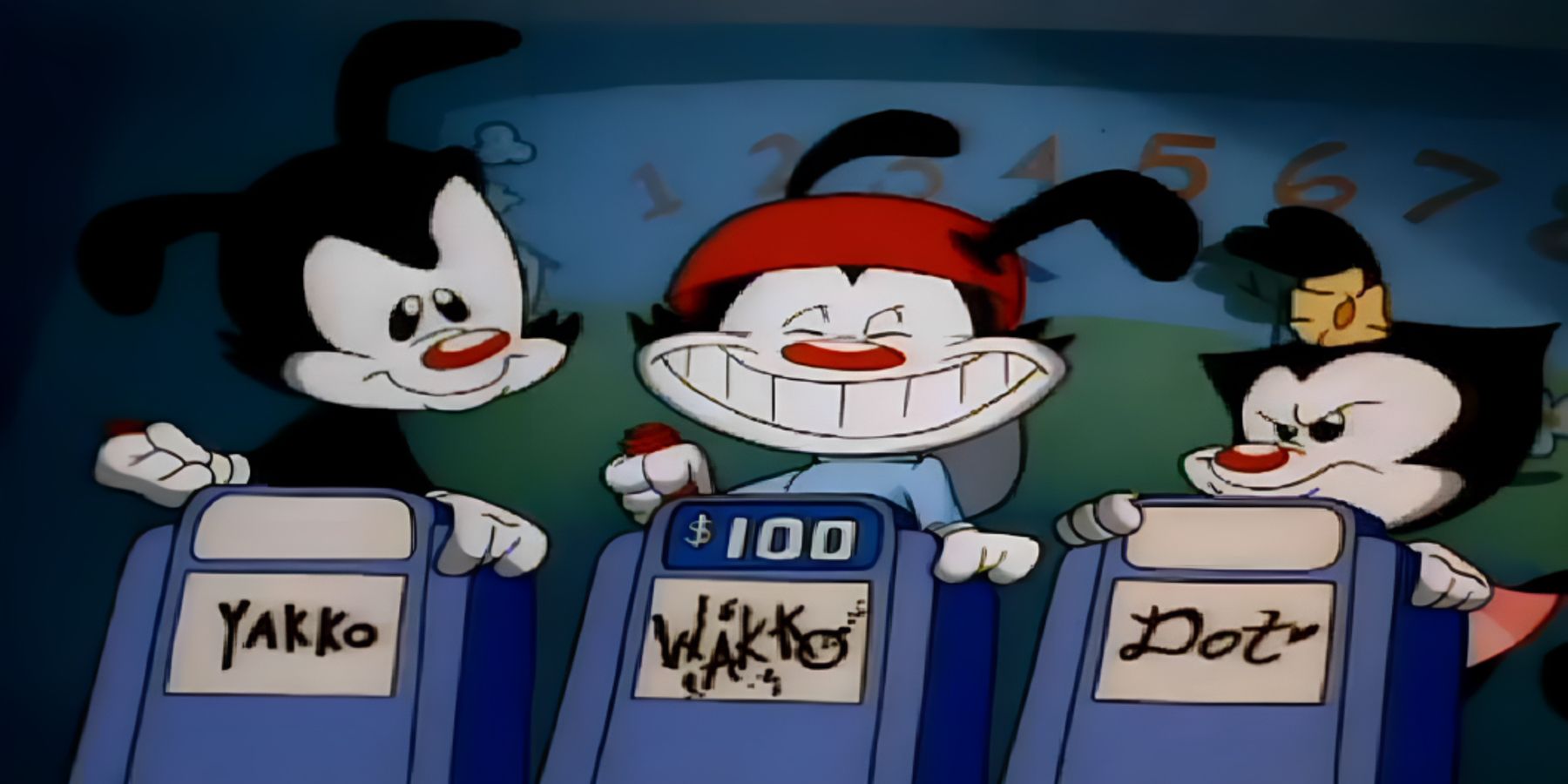 A still from an episode of classic Animaniacs of Yakko, Wakko, and Dot participating in a gameshow.