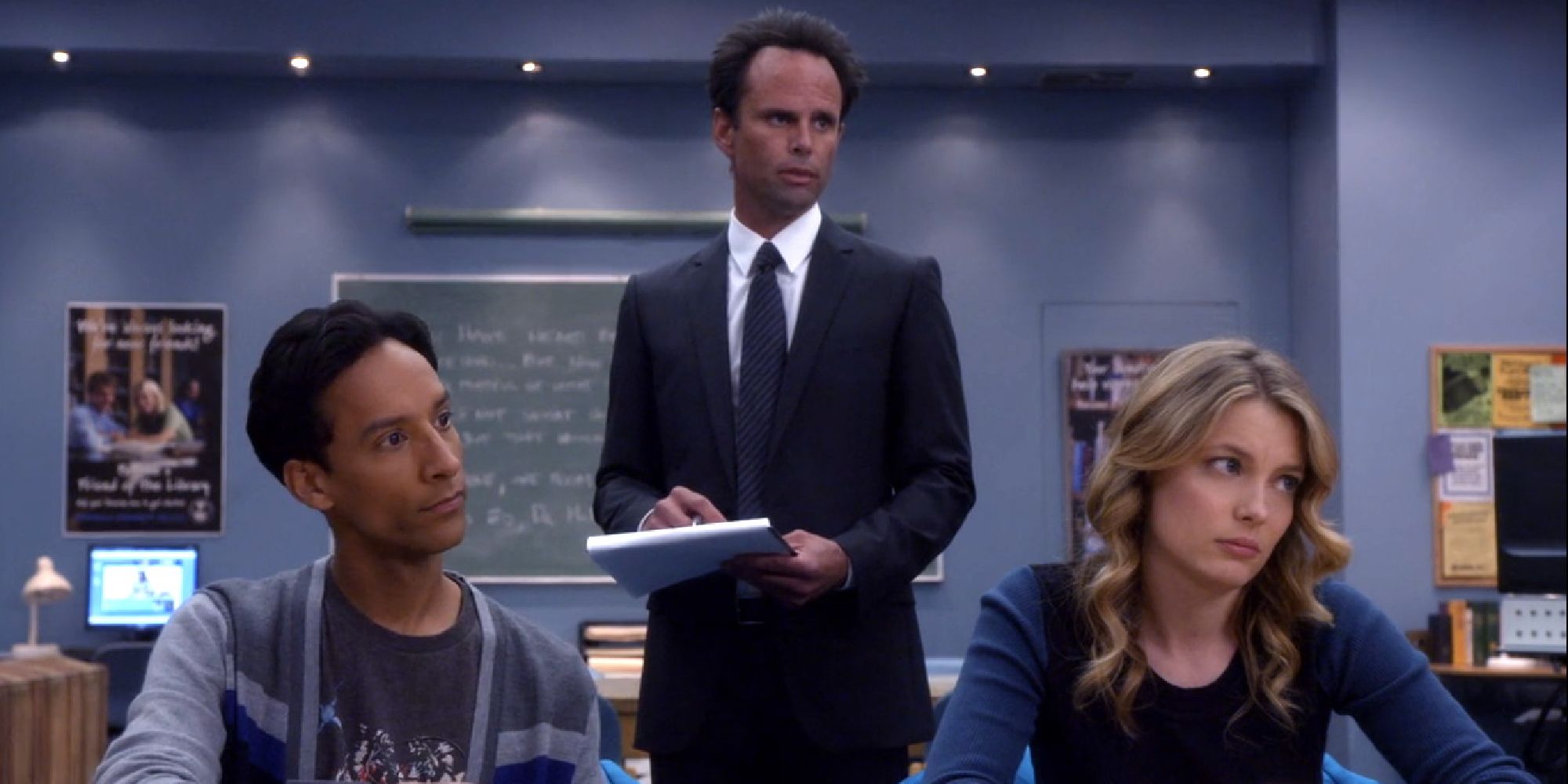 Walton Goggins standing over Abed and Britta in the study room