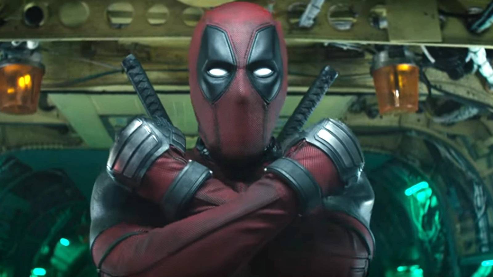 Deadpool making an X with his arms in Deadpool 2