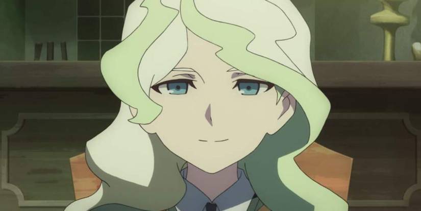 A young blonde woman with blue eyes and a school uniform