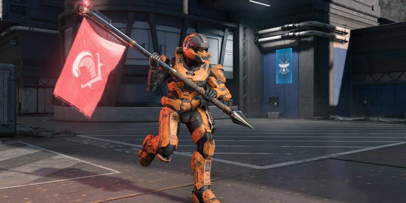 A player running with a red flag in Halo Infinite