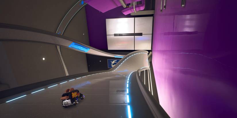 A toaster van driving on a community basement track in Hot Wheels Unleashed