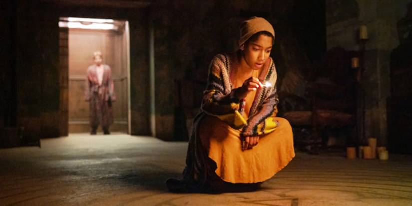 Kevin standing in the elevator and Illonka using a flashlight in The Midnight Club