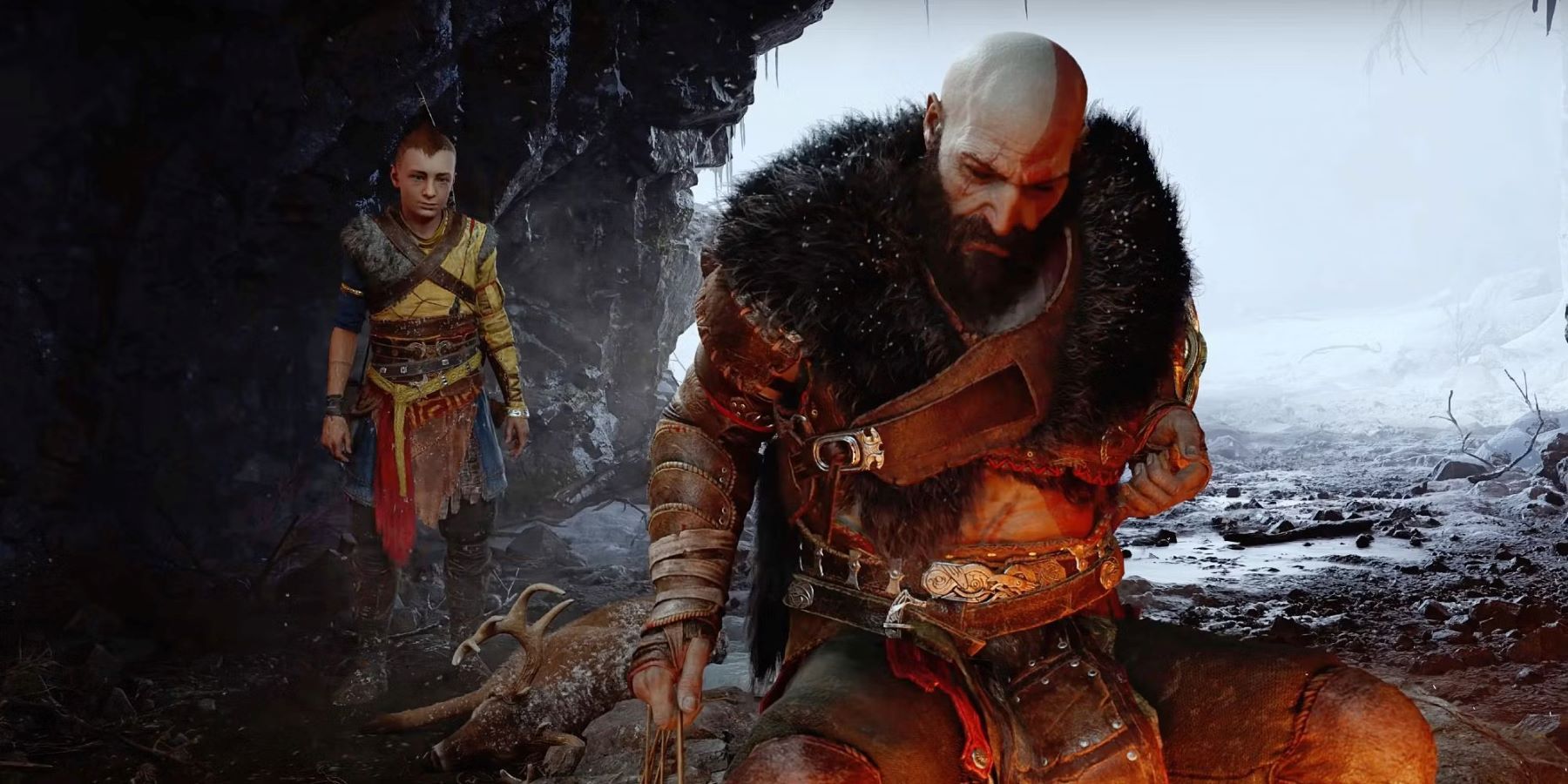 Kratos and Atreus camping in a cave in God of War Ragnarok